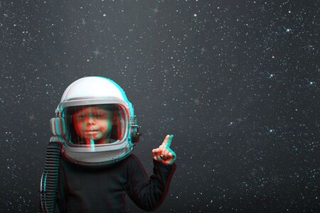 Small child wants to fly an airplane wearing an airplane helmet. effects glitchの写真素材