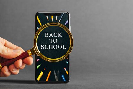 cellphone phone on the gray backgrounds for advertisement  back to schoolの写真素材