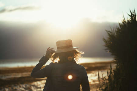 forces a girl who meditates at sunset on the seaの写真素材