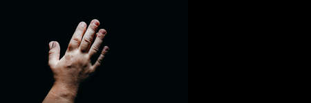 child praying hands in the darkの写真素材