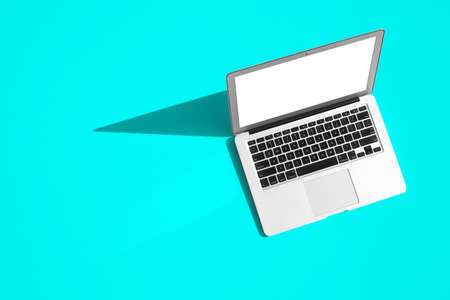 modern laptop computer on the tabl on the color backgroundの写真素材