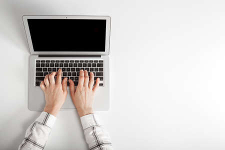 people sits on a work with a laptop computer for a table on the blackboard background