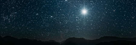 The star shines over the manger of christmas of Jesus Christ.