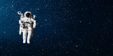 astronaut flies over the earth in space.の写真素材