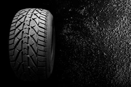 black isolation rubber tire, on the snow backgrounds