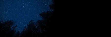 The moon shines over the manger of christmas of Jesus Christ.の写真素材