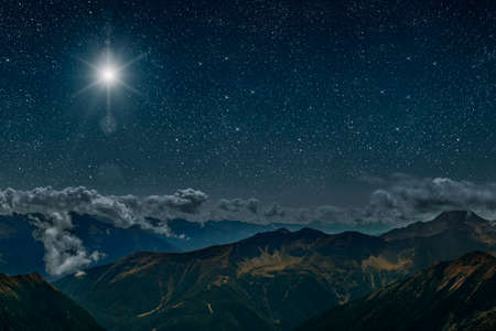 The star shines over the manger of christmas of Jesus Christ. panoramaの写真素材