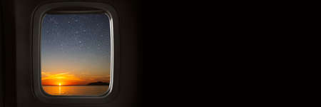 the view from the airplane window on the night skyの写真素材