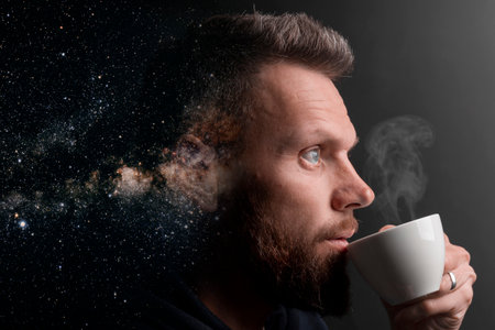 a man who marvels into the distance on a black background with the effect of double exposureの写真素材