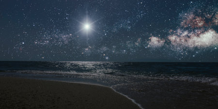 a Christmas star shines at night over the mountains of Bethlehem