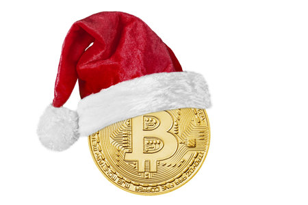 a bitcoin coin with a Santa Claus hat for Christmasの写真素材