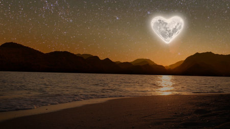 a moon heart-shaped shines over sea on Valentine's dayの写真素材