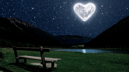 a moon heart-shaped shines over sea on Valentine's dayの写真素材