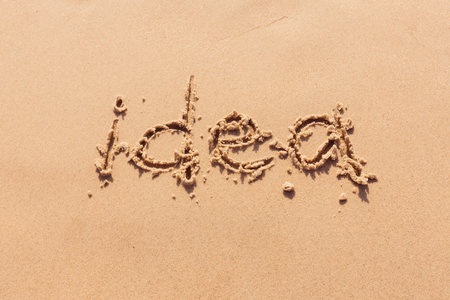 inscription on the seashore with palm treesの写真素材