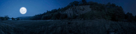 The night Christmas panorama with a moon in the skyの写真素材