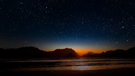 a movement of stars in the night sky with the view of mountains. . High quality photoの写真素材