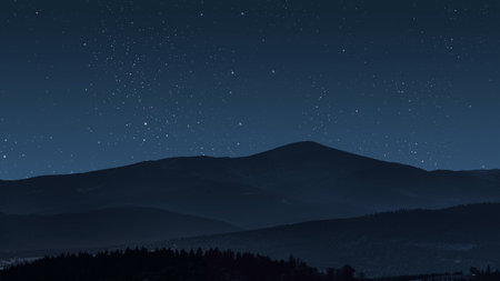 aa movement of stars in the night sky with the view of mountains.の写真素材