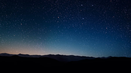 aa movement of stars in the night sky with the view of mountains.の写真素材
