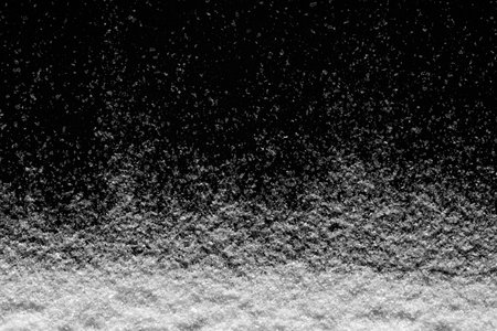 white snow on the black background