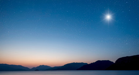 a Christmas star shines at night over the mountains of Bethlehem.