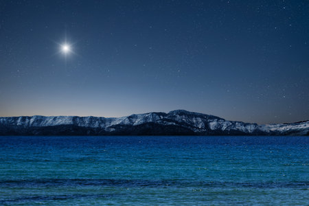 a Christmas star shines at night over the mountains of Bethlehem.の写真素材