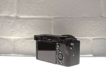 Sony 7C black is compact and elegant. Editorial. Light background. The best mirrorless cameras from top brands.のeditorial素材