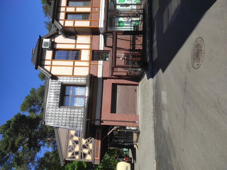 Modern and lovely homes with nature all around. A sunny summer day. Modern and old houses in Russia, Kaliningrad region, Svetlogorsk. Beautiful fences (fences). Architecture 2021, peaceful buildings.の写真素材