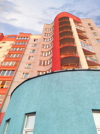 An architectural building with a rounded shape. Blue, red, and white building colors.の写真素材