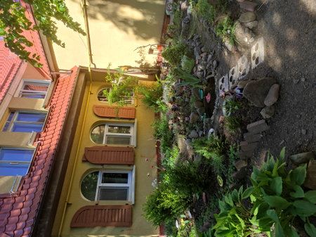 Modern and lovely homes with nature all around. A sunny summer day. Modern and old houses in Russia, Kaliningrad region, Svetlogorsk. Beautiful fences (fences). Architecture 2021, peaceful buildings.の写真素材