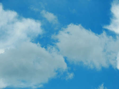 Blue sky with clouds over Russia. Summer skies. Russian sky with clouds. Gray-white and blue colors. Eco Sky in 2021. A sunny day.の写真素材