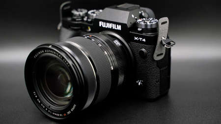 Fujifilm X-T4 kit 16-80 mm black. The best mirrorless camera. On a dark background.のeditorial素材