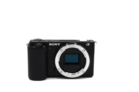 Mirrorless camera for video bloggers. Top blogger camera Sony Alpha ZV-E 10 kit 16-50mm black. On a white background.のeditorial素材