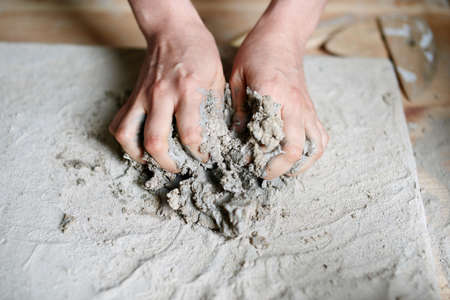 Pottery artist making a pot from clay
