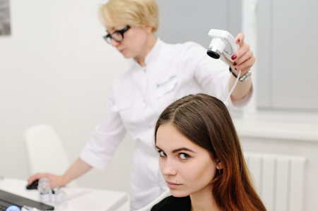 Trihoskopiya - is a method of hair examination using a special device - trihoskopa.の写真素材