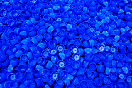 lots of plastic blue pet bottle caps