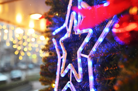 star on a Christmas tree on a background of Christmas lights.