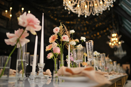 beautiful elegant decor of flowers and elegant serving on the wedding table.
