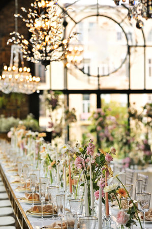 beautiful elegant decor of flowers and elegant serving on the wedding table.