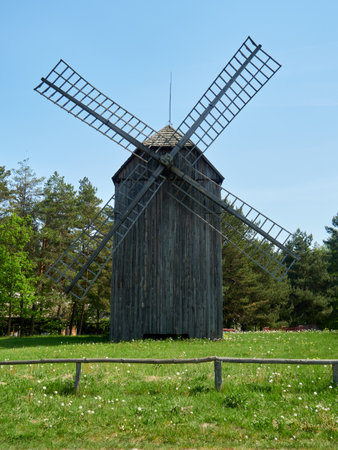 Old wooden windmill on a meadow in the parkの写真素材