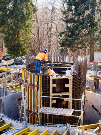 Workers on the construction site of a new residential building in winterの写真素材