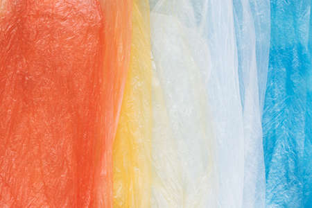 Colorful plastic shopping bags in rainbow layout for eco waste concept. Flat lay.の写真素材