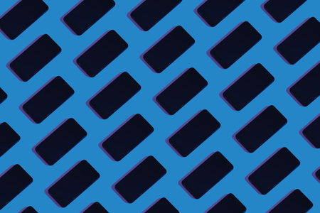 Duotone trendy smartphone pattern on blue background. Flat lay conceptの写真素材