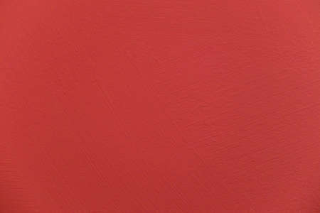 Red paint with streaks on concrete weathered wall. Artistic backdropの写真素材