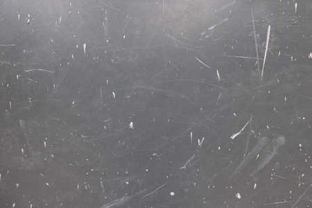 Gray surface wall with scratches and white paint streaks. Abstract art backdropの写真素材