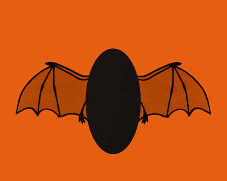 Bat wings flying with card stock body and room for text. Orange and black Halloween concept.の写真素材