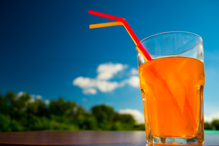 orange juice against the skyの写真素材
