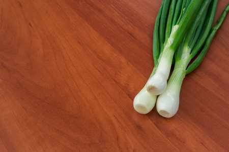 onion leaves on a wooden backgroundの写真素材