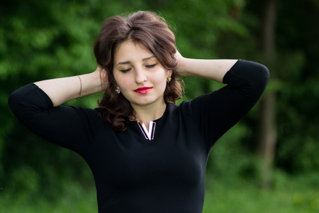 Beautiful girl with curly hair outdoorの写真素材