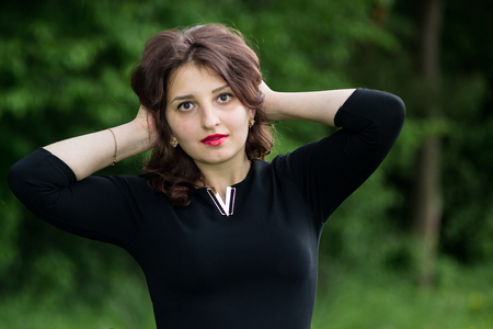 Beautiful girl with curly hair outdoorの写真素材