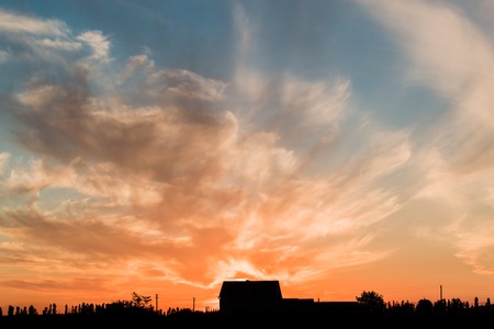 Beautiful sunset in summer. Fascinating nature.Golden sky and clouds.の写真素材